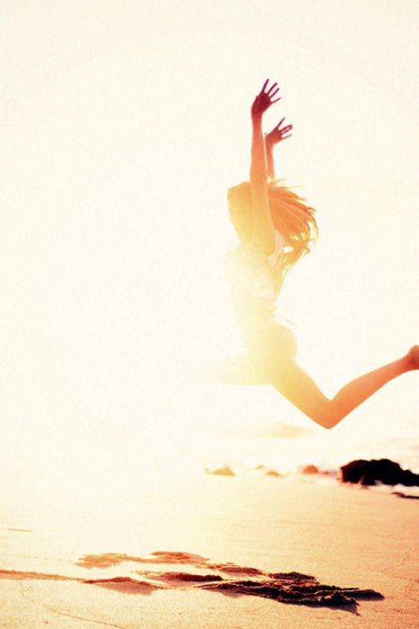 girl jumping on beach dance